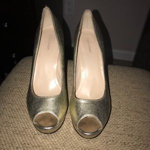 Gold heels with a small platform under toe!